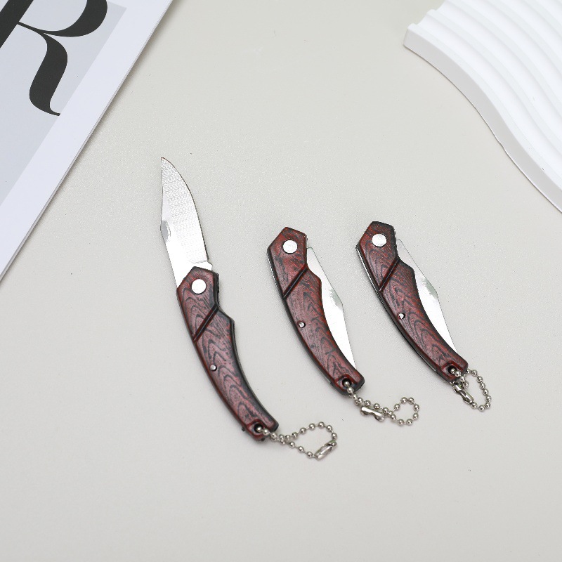 Wood-grain folding fruit knife with chain, portable camping knife, sharp folding knife for household use, dormitory knife for students to open packages details Picture