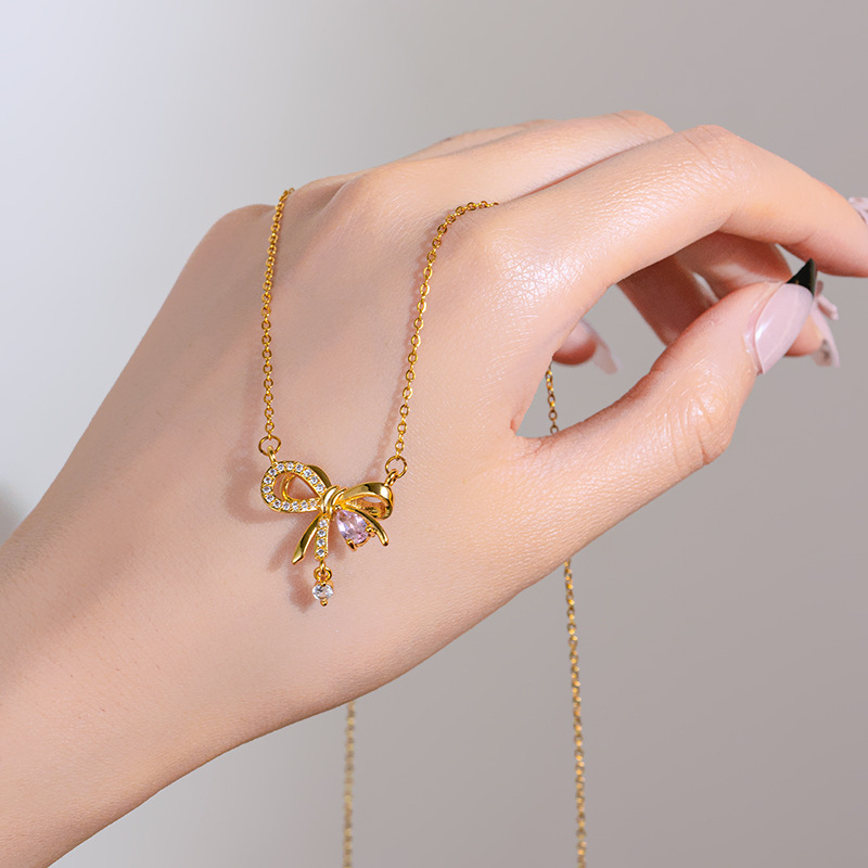 Korean-style golden pink diamond bow necklace, a niche design for women, a popular collarbone chain, a light luxury and versatile accessory details Picture