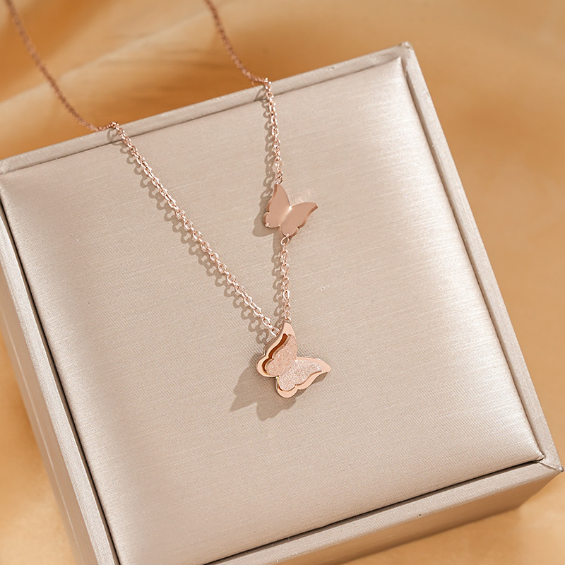 Fashionable titanium steel matte double butterfly pendant, titanium steel necklace for women, vacuum electroplated color retention, high-end collarbone chain wholesale Application Scenario
