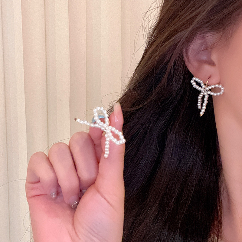 French sweet pearl bow ear buckles, high-end elegance, versatile earrings, niche design sense, new earrings for women details Picture
