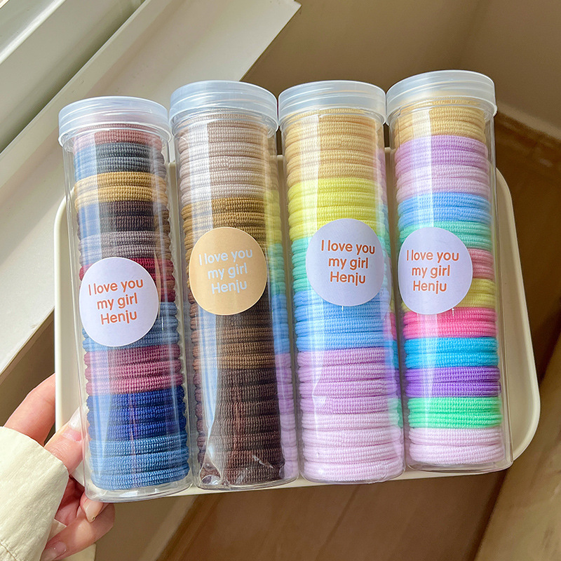The hair band is practical and durable. It is a children's hair tie in a box that won't damage hair. It is a basic color elastic ponytail hair tie details Picture