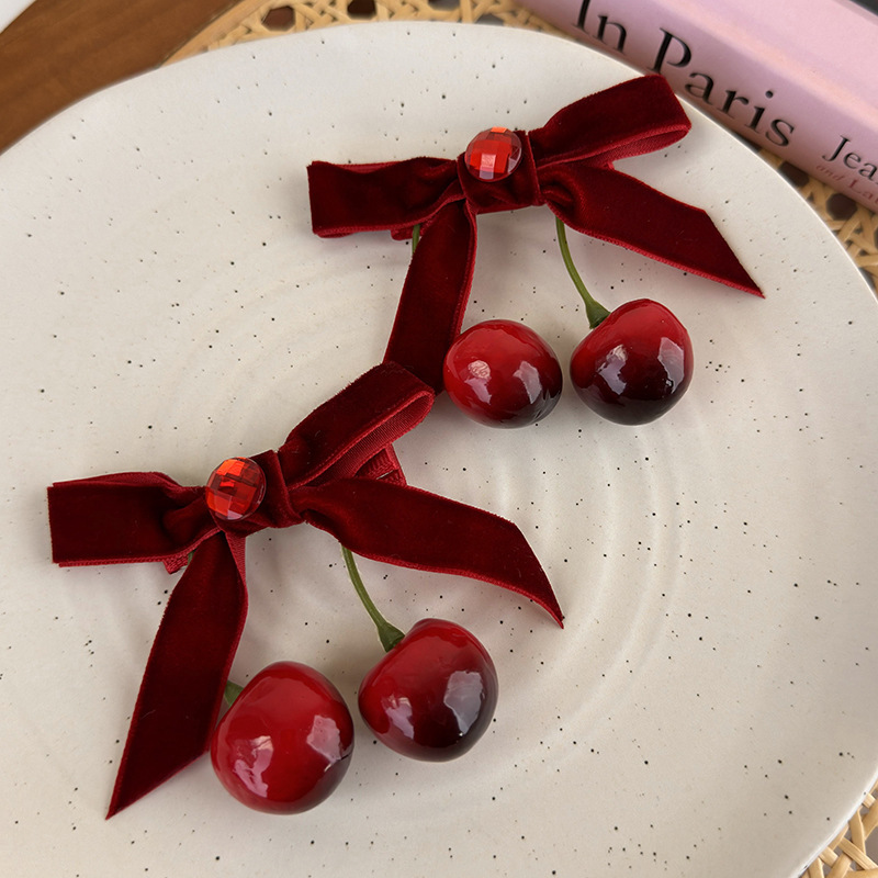 Winter atmosphere: Red cherry bow velvet hair clip, half a hair clip at the back of a woman's head, headwear and hair accessory full figure