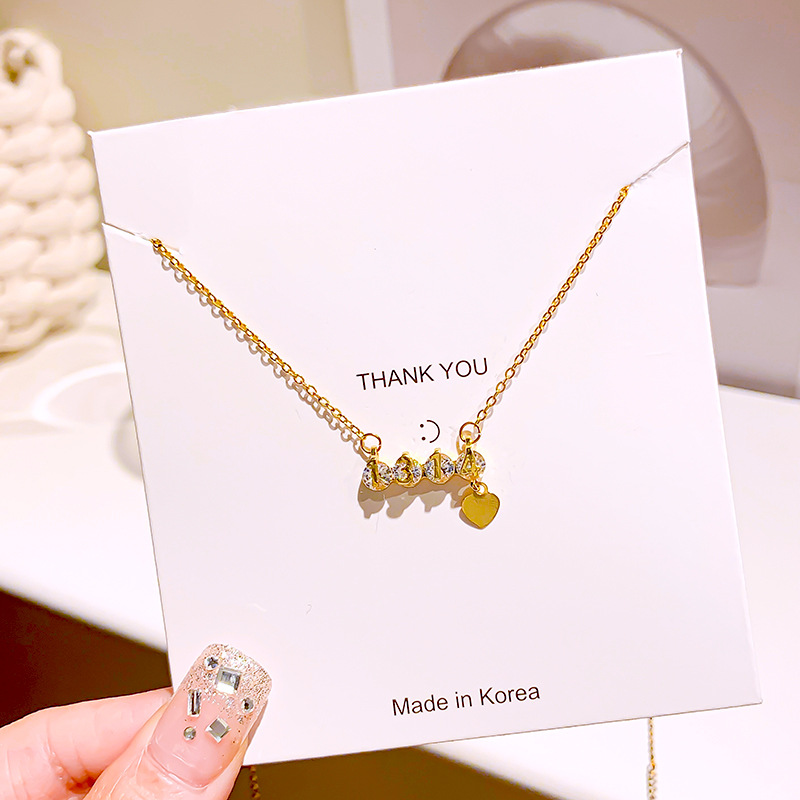 "Forever and Ever 1314 diamond-encrusted titanium steel necklace, women's heart tassel pendant, light luxury and high-end collarbone chain accessory. Application Scenario