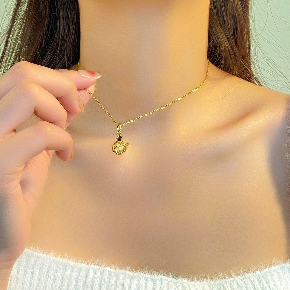 A light luxury style hollowed-out small planet pendant titanium steel necklace for women, simple and versatile fashion collarbone chain, a trendy and elegant neckchain Application Scenario