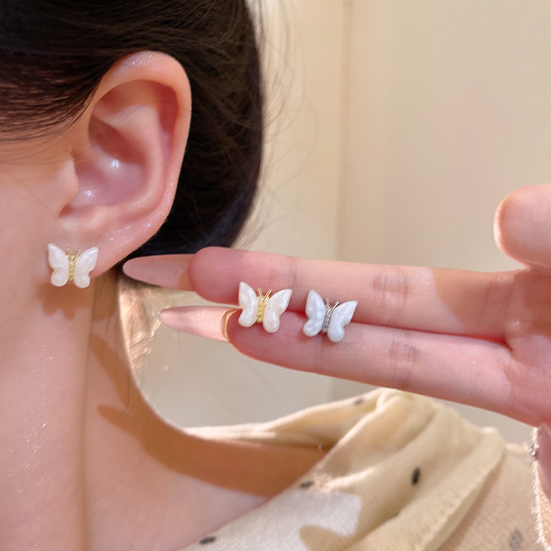 Super fairy-like white oil-dripping butterfly stud earrings for women, unique and simple earrings, light luxury and high-end elegance, wholesale of internet-famous earrings details Picture