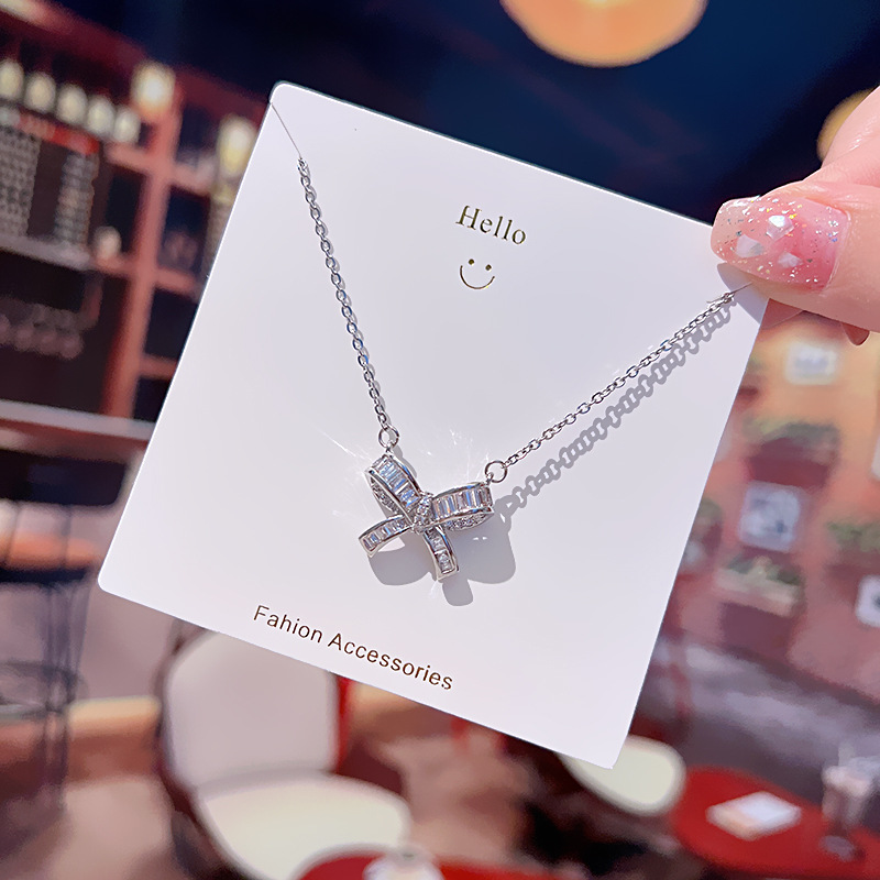 A silver bow titanium steel necklace with a Japanese and Korean design sense, a delicate zircon light luxury collarbone chain for women, and a versatile accessory for Internet celebrities details Picture