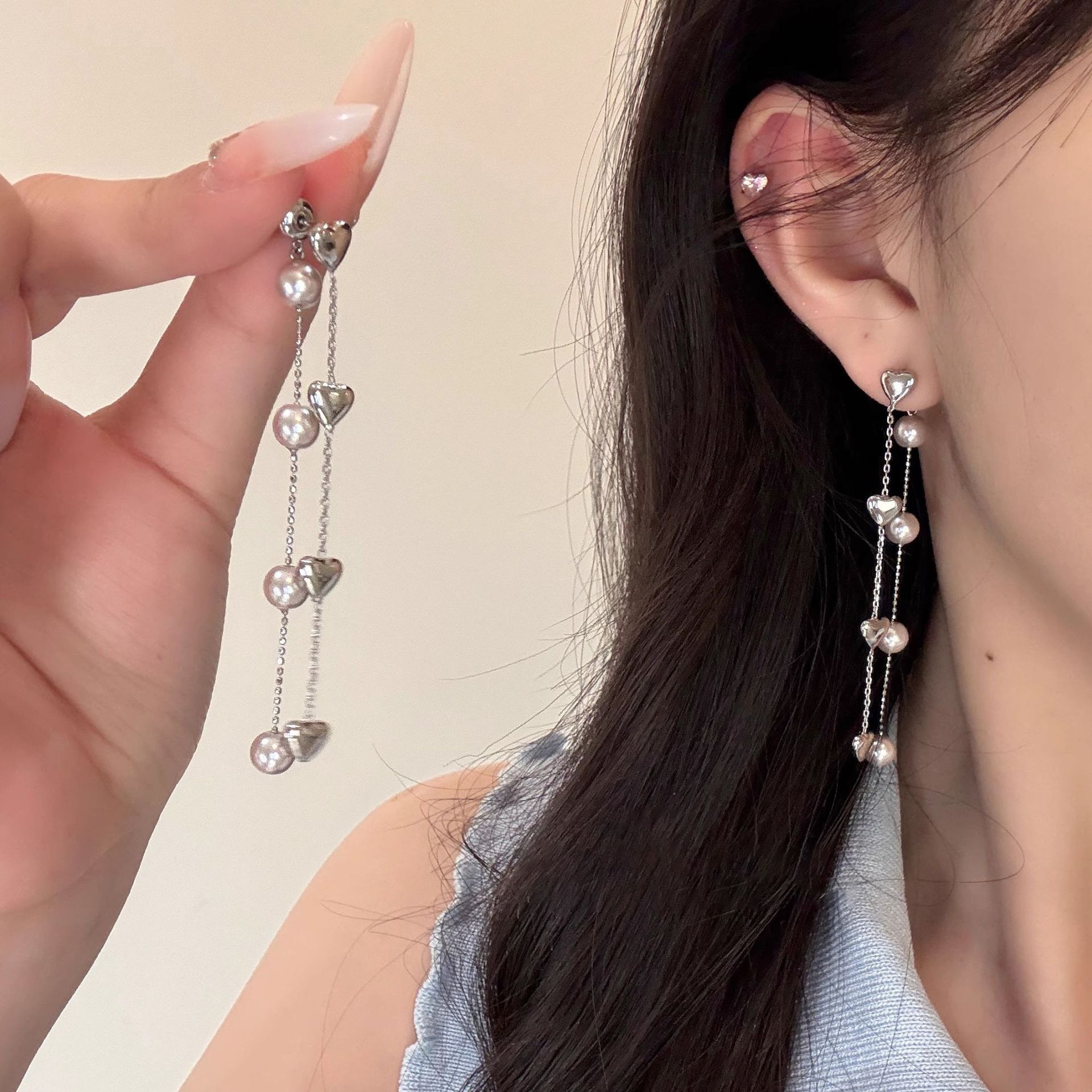 Korean-style back-hanging heart-shaped pearl tassel earrings, high-end women's light luxury long earrings, face-enhancing small earrings wholesale full figure