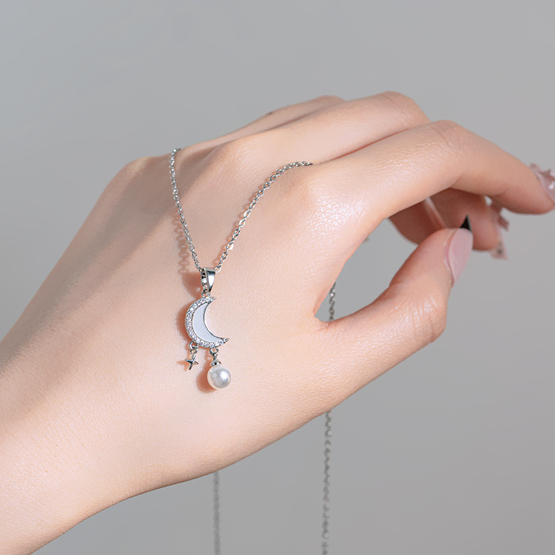 Silver niche design sense moon and star hanging pearl pendant titanium steel necklace, simple and elegant, light luxury collarbone chain for women details Picture