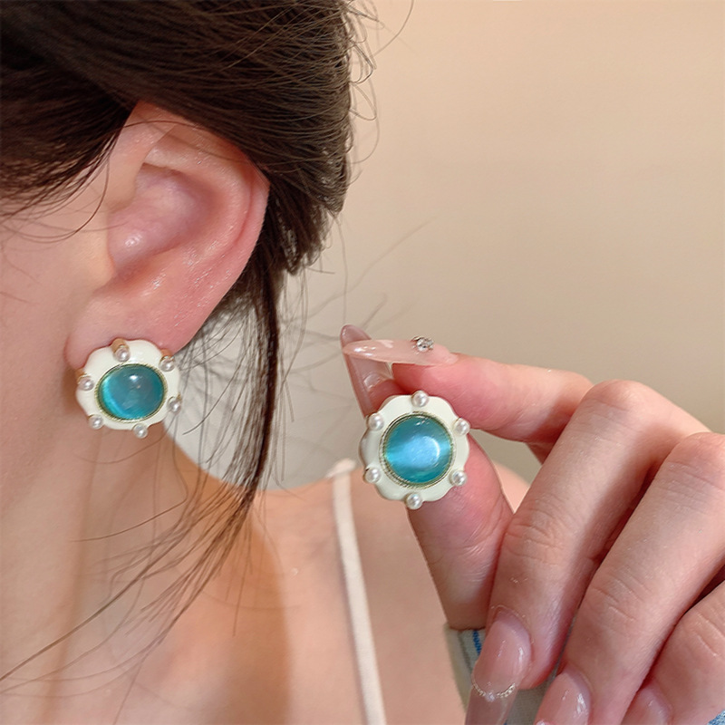 French navy blue cat's eye stone round earrings for women, a light luxury and high-end look in summer, oil-dropping stud earrings, and elegant pearl earrings details Picture