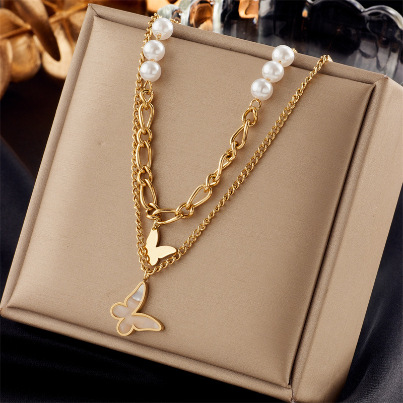 A new, fashionable, retro and niche design from Europe and America. Double-layer irregular chain beaded butterfly pendant titanium steel necklace full figure