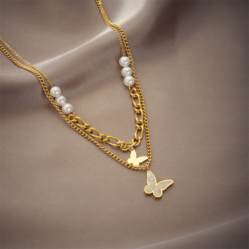 A new, fashionable, retro and niche design from Europe and America. Double-layer irregular chain beaded butterfly pendant titanium steel necklace details Picture