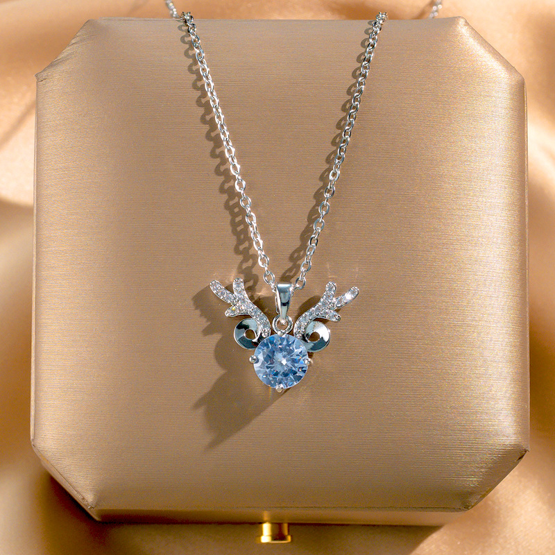 A Japanese and Korean forest-style antler pendant titanium steel necklace for women, an Instagram diamond-encrusted, fresh and versatile collarbone chain, a light luxury accessory Application Scenario