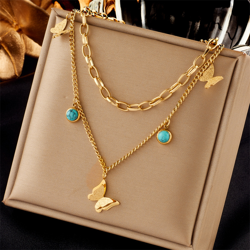 A cross-border fashion and niche double-layer overlapping blue turquoise pendant three-dimensional butterfly titanium steel jewelry necklace from Europe and America full figure