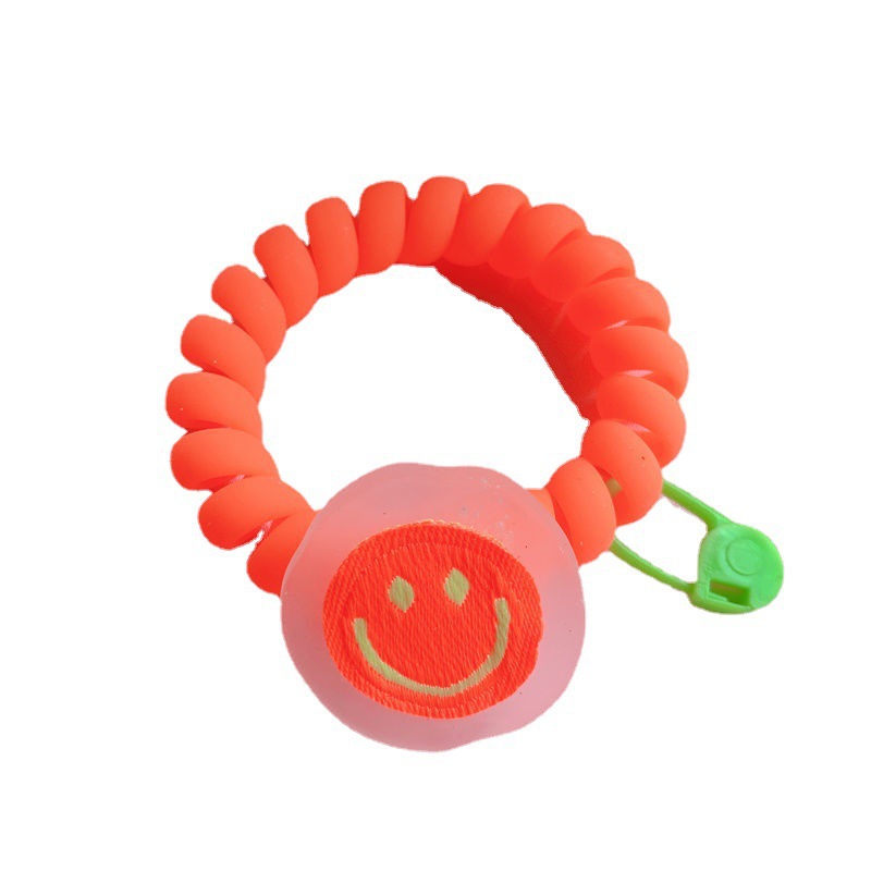 In Dongdaemun, South Korea, there is a matte texture smiley face telephone line hair band. The girl has a fluorescent color fashionable hair tie and a bun headband Item Picture