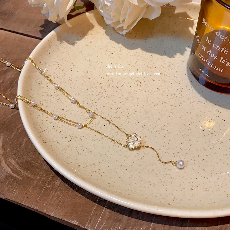 Double-layer stacked camellia pearl necklace for women, light luxury and versatile, elegant collarbone chain, niche design jewelry wholesale Application Scenario