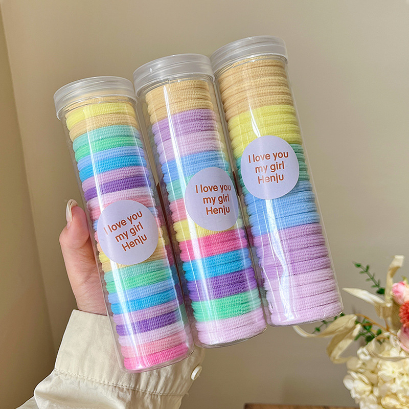 The hair band is practical and durable. It is a children's hair tie in a box that won't damage hair. It is a basic color elastic ponytail hair tie Application Scenario
