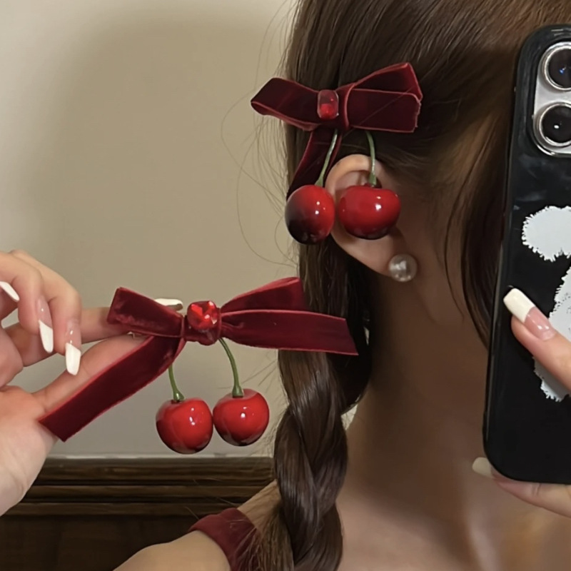 Winter atmosphere: Red cherry bow velvet hair clip, half a hair clip at the back of a woman's head, headwear and hair accessory details Picture