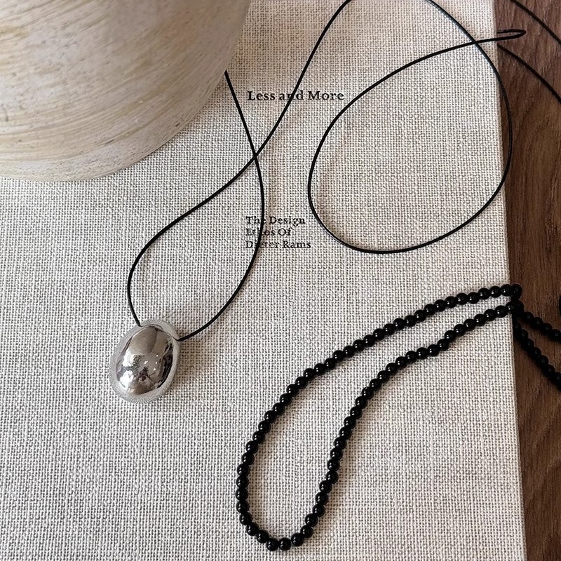 Black beaded necklace with a unique female feel, silver pendant sweater chain, 2024 new style, black leather rope collarbone chain details Picture