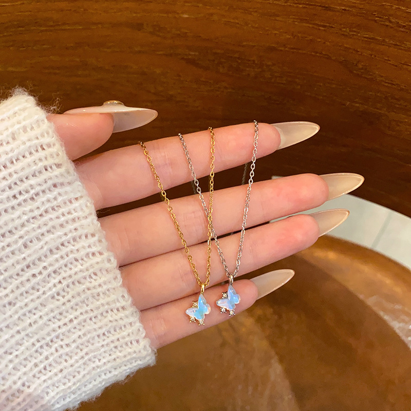 A sea blue butterfly pendant titanium steel necklace for women, with a light luxury, niche and high-end feel, a small star collarbone chain necklace accessory full figure