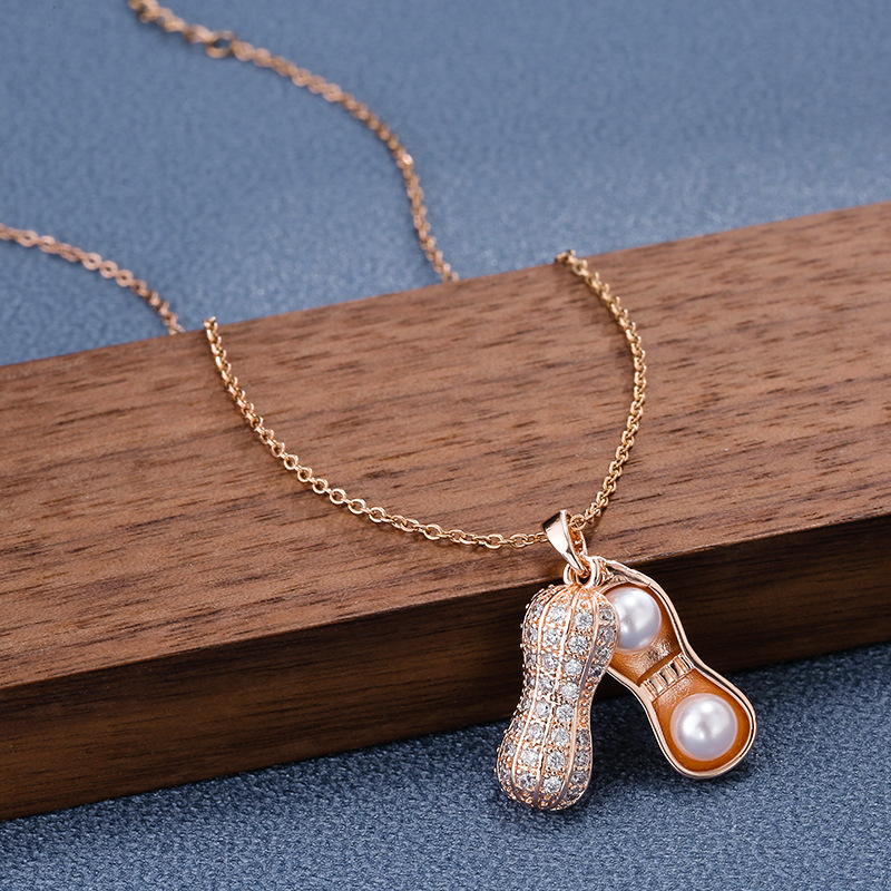 Korean 18k rose gold diamond-encrusted pearl peanut pendant necklace, a trendy and versatile women's Instagram style, a luxurious titanium steel necklace full of diamonds Specification drawing