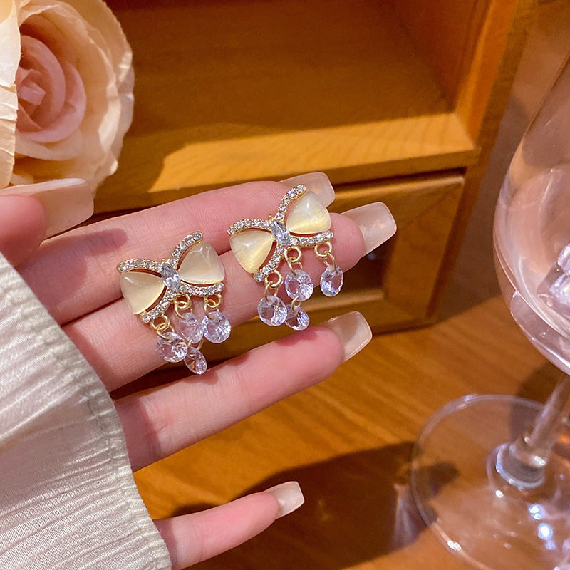 S925 silver needle exquisite micro-inlaid bow zircon earrings, high-end women's fringed stud earrings, versatile and elegant earrings full figure