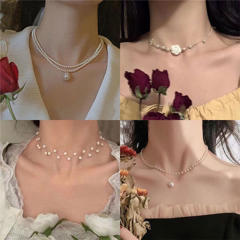 The pearl necklace exudes a feminine retro charm and a sweet French Chanel style. It features a double-layer collarbone chain with a niche design and a new style for 2024 full figure
