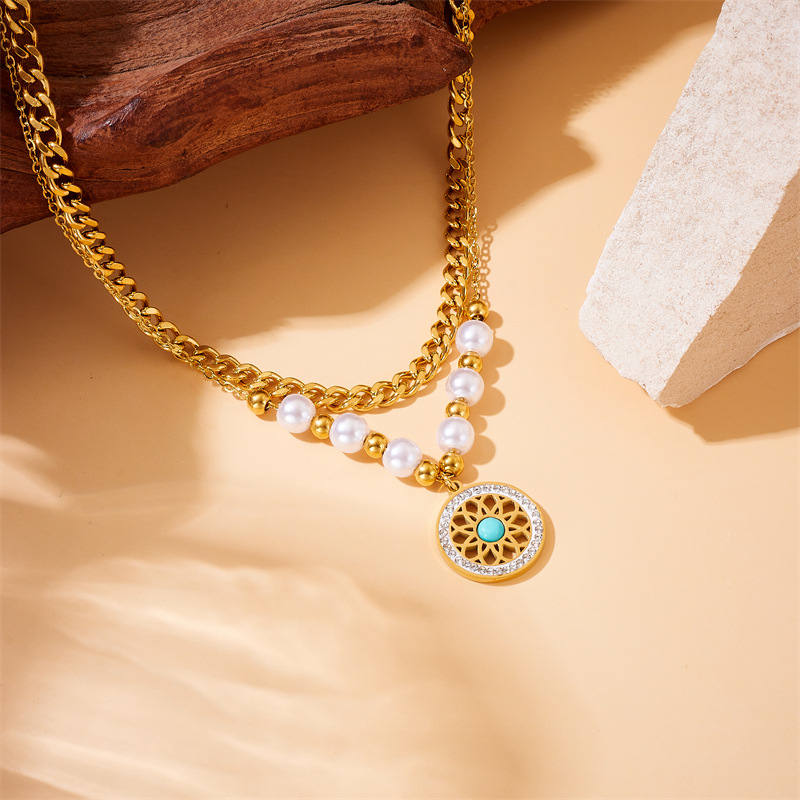 A retro necklace with European and American fashion style, inlaid with pearls, heart-shaped cross eyes, turquoise pendants and double-layer stainless steel details Picture