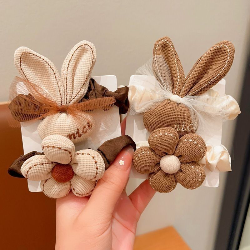 Autumn and winter milk coffee flower bow hair tie, children's cartoon high-elasticity hair tie, girls' hair tie, hair band, girls' hair tie Application Scenario