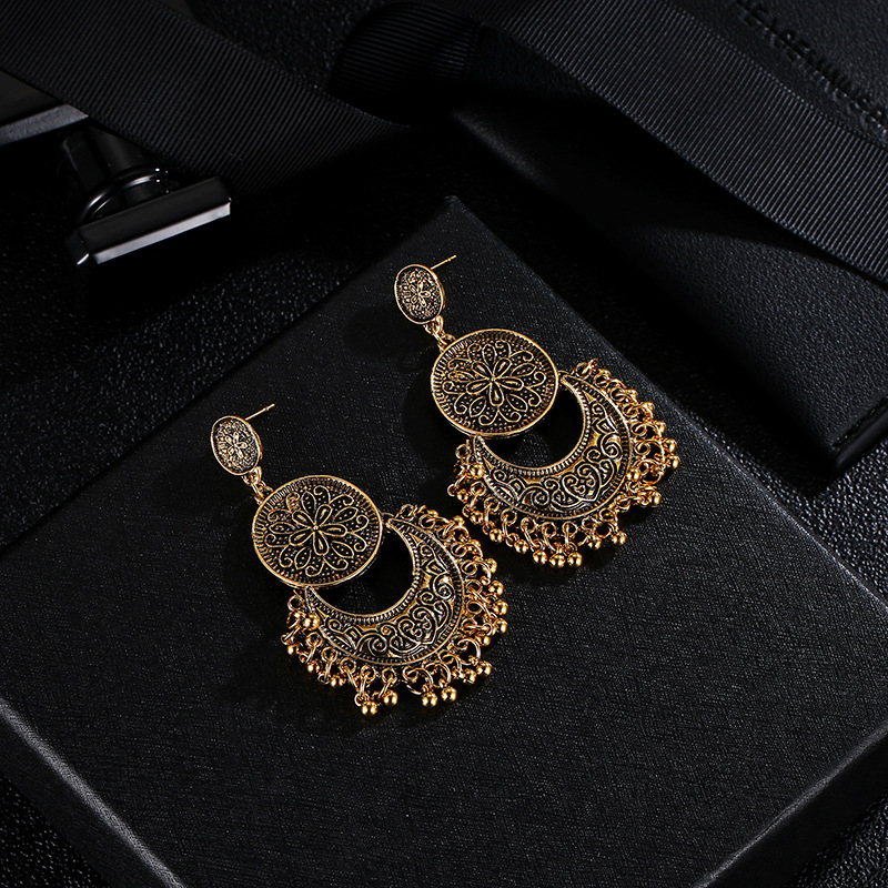 European and American retro hollowed-out crescent tassel earrings, Bohemian sun and moon shaped carved round bead tassel women's earrings Application Scenario