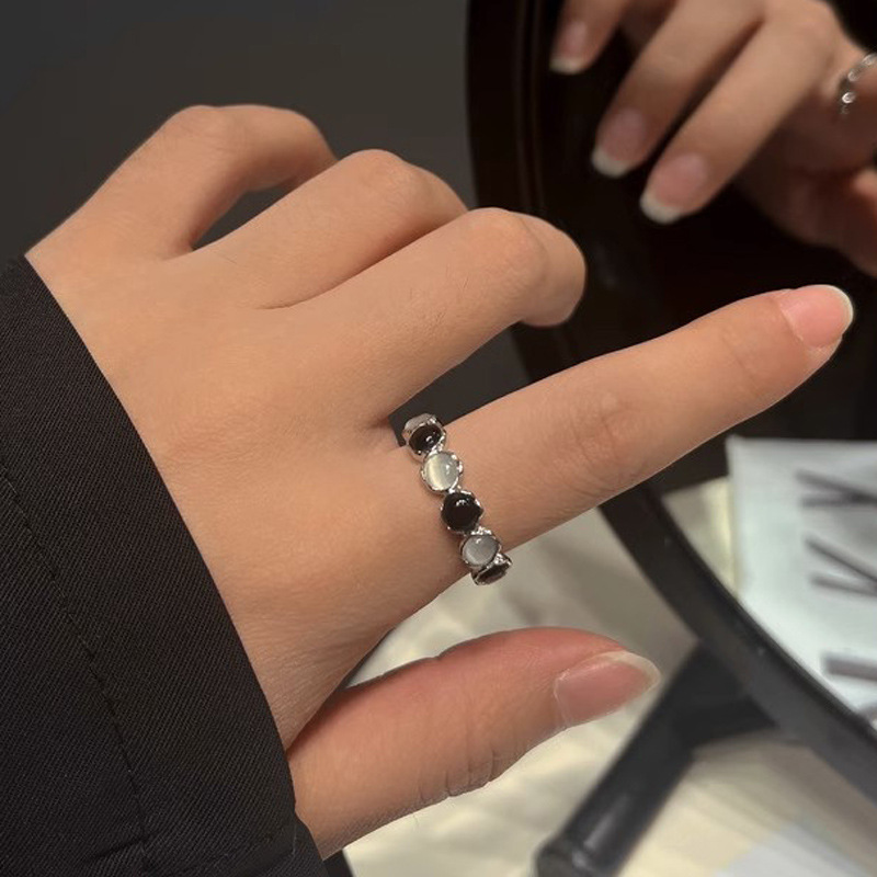 A niche design with black and white contrasting moonstone open ring for women on Instagram, featuring a cold style, high-end and light luxury personality full figure