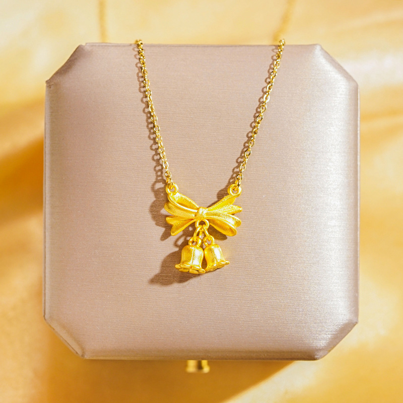 A genuine gold electroplated matte gold titanium steel necklace with a unique and light luxury feel for women. It features a lotus bow and tassel collarbone chain, making it a versatile accessory Specification drawing