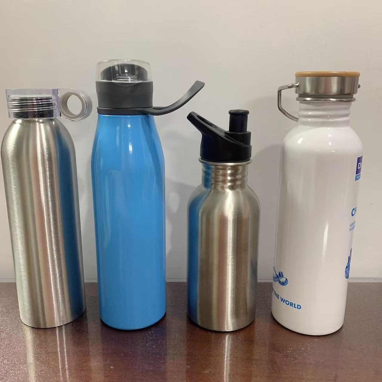 Cross-border best-selling single-layer stainless steel sports water bottle with hand-held lid, American-style large mouth, portable for outdoor mountain climbing and travel full figure