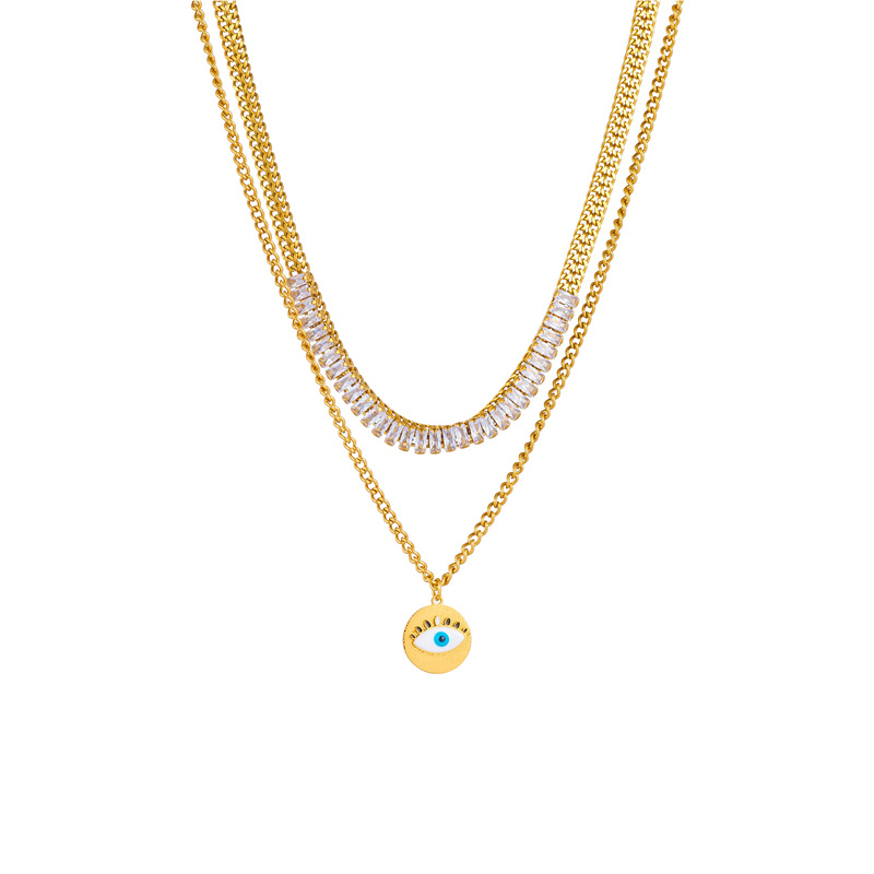 This is a unique and fashionable design from Europe and America. It features a double-layered chain with diamonds, a round eye pendant, and a titanium steel gold-plated necklace Item Picture