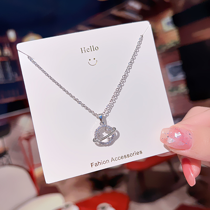 A new Japanese and Korean style smiley face planet pendant titanium steel necklace, a rare collarbone chain for women, and a high-end and versatile accessory Application Scenario