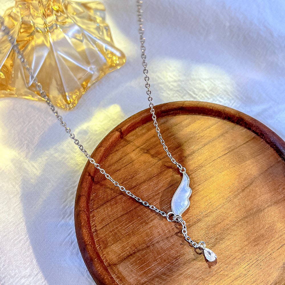 Japanese and Korean light luxury titanium steel necklace, women's niche design sense Angel wing pendant, tassel collarbone chain, non-fading accessory details Picture