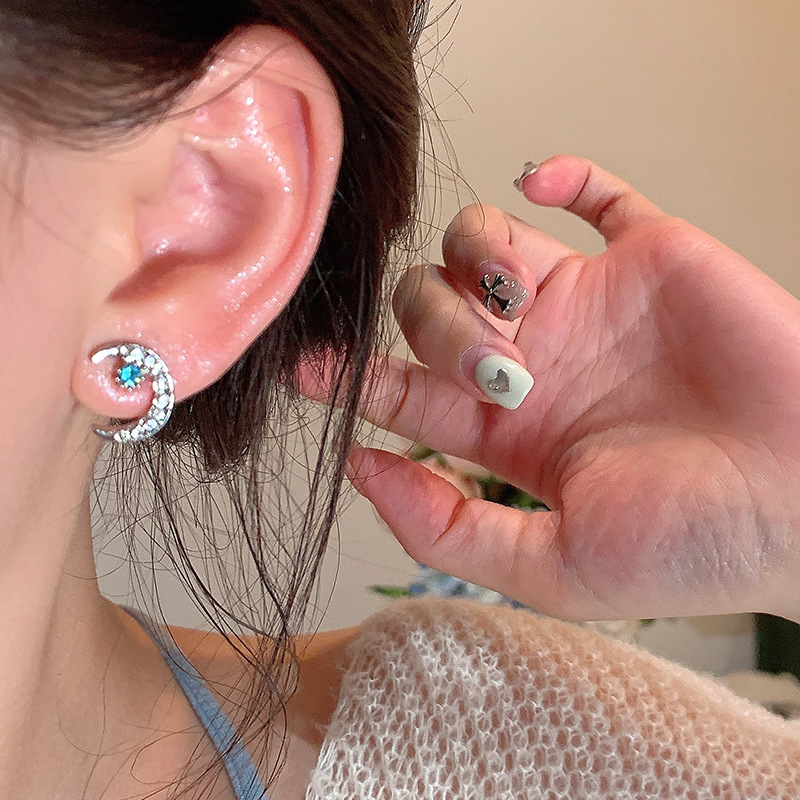 Wholesale of sea blue heart-shaped zircon ear stud earrings with a cold and elegant feminine style, exquisite micro-inset moon ear stud earrings, and a versatile and personalized accessory Application Scenario
