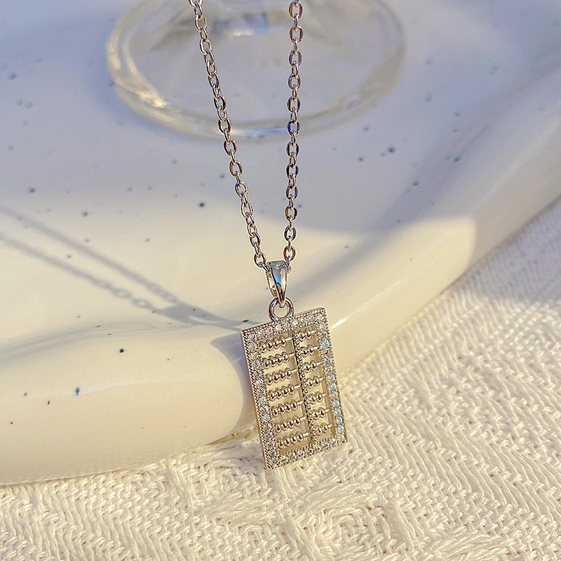 A light luxury Japanese and Korean pendant with a small abacus and titanium steel necklace, a fashionable collarbone chain by a female Internet celebrity, and a niche high-end accessory details Picture