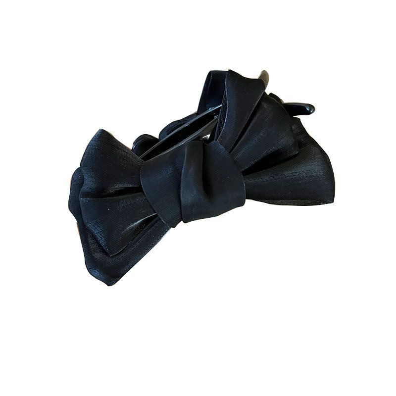 A cute red bow bun clip for a princess on the run, a popular hair accessory for both children and adults Item Picture