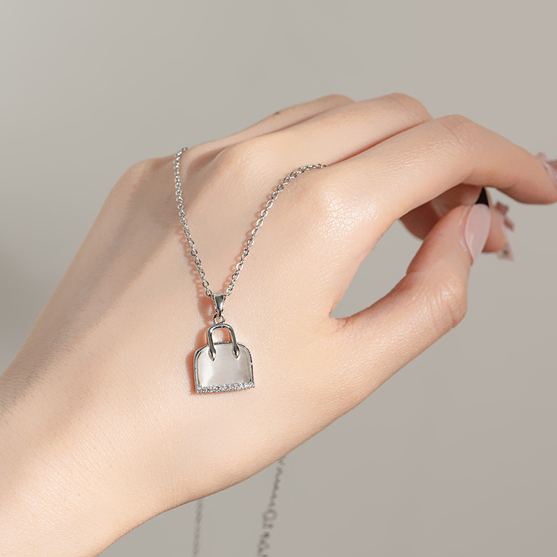 New Korean version silver cat's eye stone bag necklace, women's niche design sense, full diamond pendant, elegant and versatile collarbone chain Specification drawing