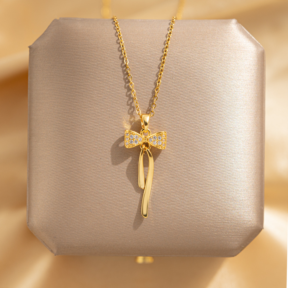 Korean version simple 18k gold-plated tassel bow necklace, a rare and light luxury titanium steel collarbone chain, a popular accessory for women full figure
