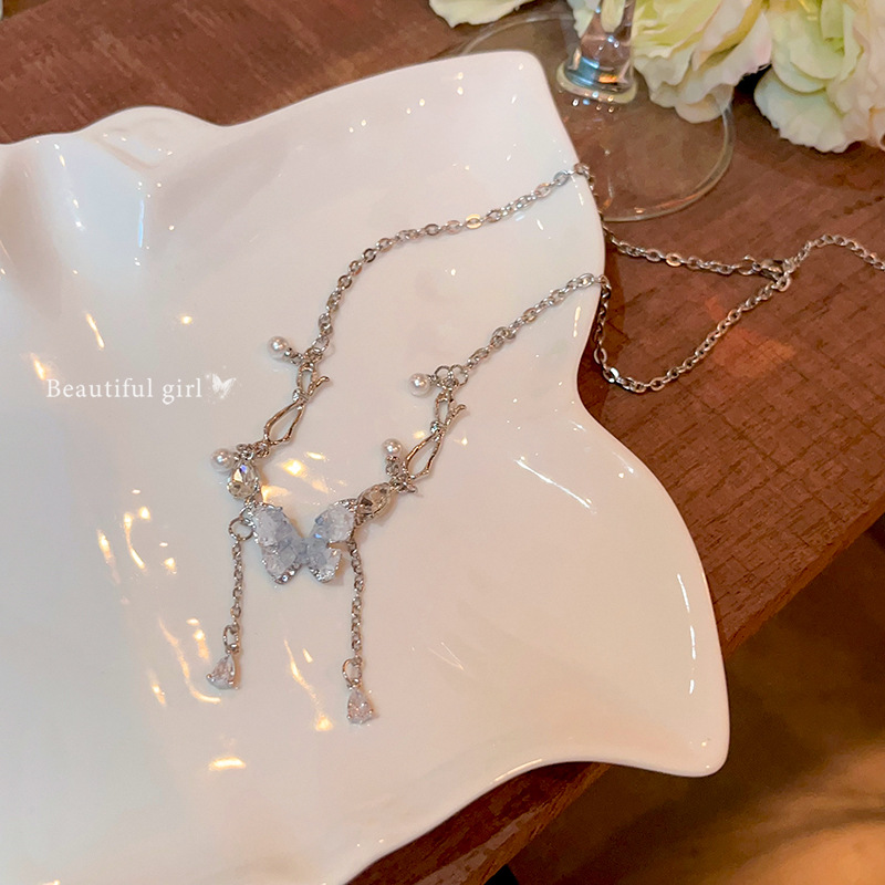 Blue crystal butterfly tassel pearl necklace, women's light luxury high-end collarbone chain, light luxury niche hot girl necklace accessory Application Scenario