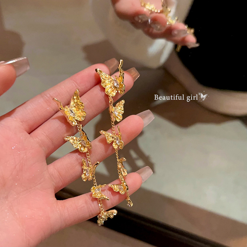Golden butterfly tassel stud earrings, women's light luxury style, micro-set earrings, retro high-end feel, liquid metal earrings full figure