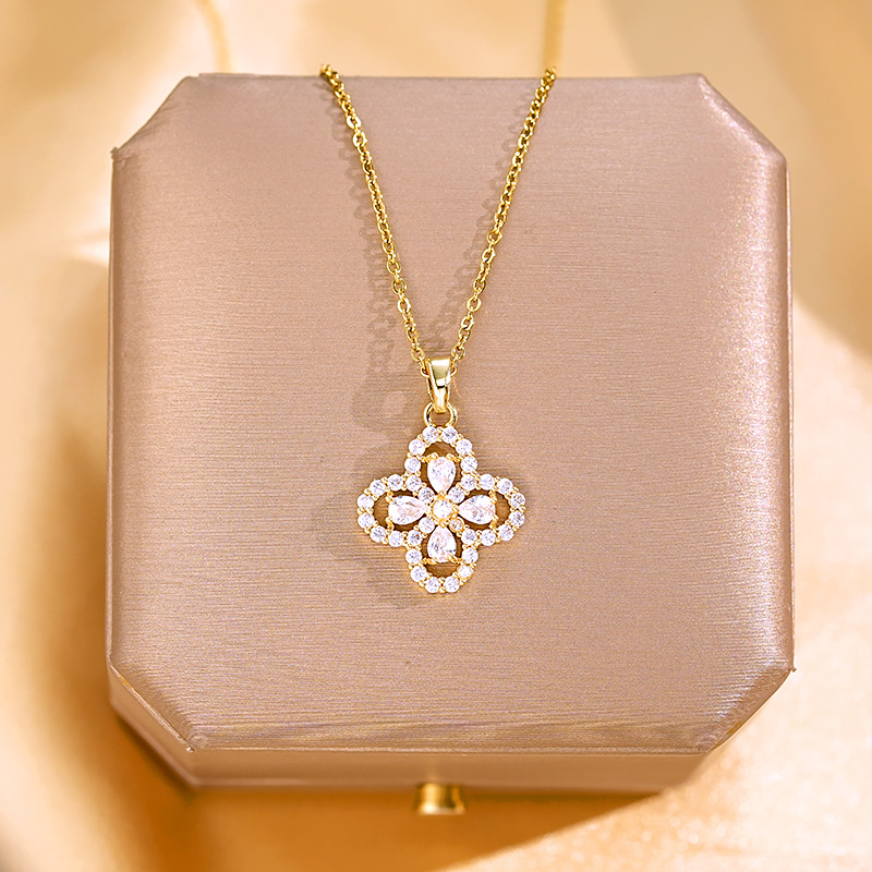 A genuine gold electroplated four-leaf clover necklace with full diamonds, a fashionable and light luxury zircon pendant, a titanium steel collarbone chain, and a high-end accessory full figure