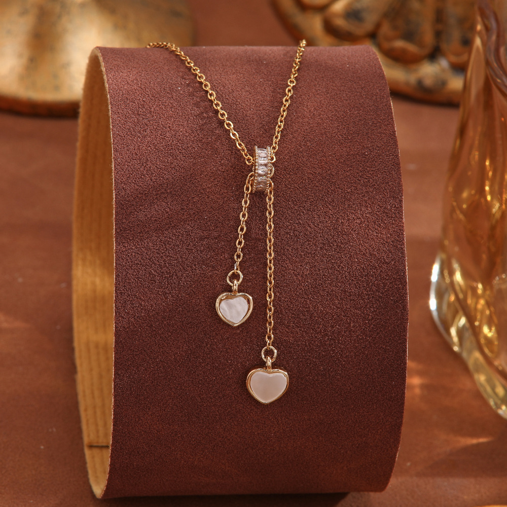 A Japanese and Korean light luxury design sense cat's eye stone pendant titanium steel necklace that doesn't fade, a delicate zircon high-end collarbone chain for women details Picture