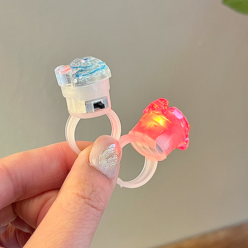 A cute little girl with a flowing sand glowing ring, a flashing light ring with a switch, cartoon jewelry, and a girl's ring Application Scenario
