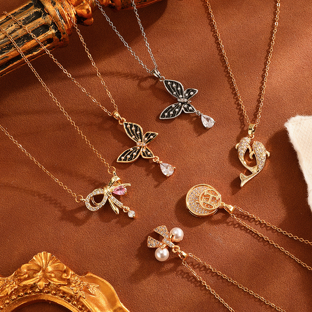 European and American fashion round letter butterfly pendant full of diamonds titanium steel necklace, niche retro design sense collarbone chain wholesale full figure