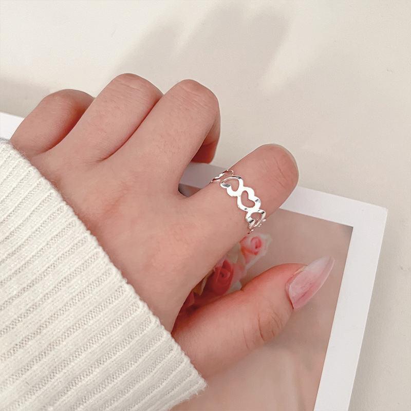 The heart-shaped hollowed-out simple and fashionable ring is exquisite, versatile, simple and good-looking. It has a trendy style and an adjustable opening for women full figure