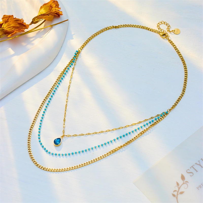 A high-end retro titanium steel necklace with a multi-layer stacked chain water drop pendant and a unique European and American style Specification drawing
