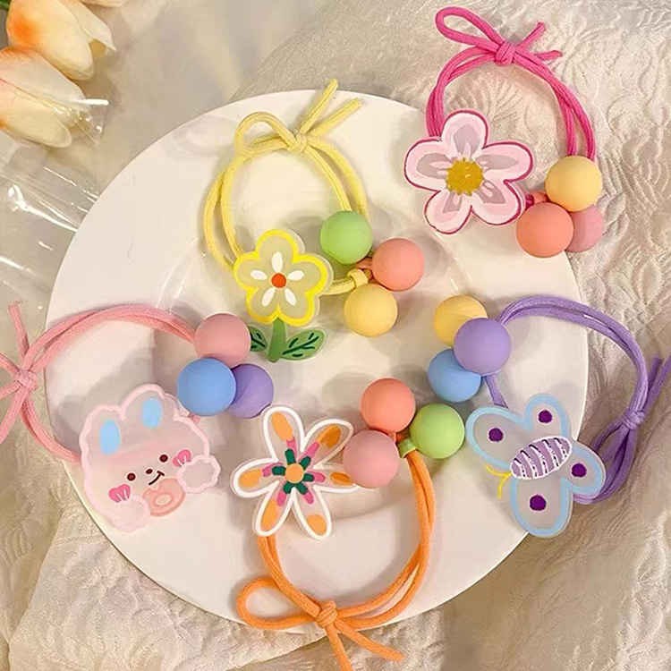Korean cute cartoon hair ties, sweet and girlish graffiti flower hair ties, little girl tied up in a ponytail bun hair circle details Picture
