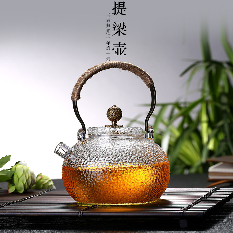 Wholesale high borosilicate glass teapots, thickened high-temperature resistant hammered glass teapots, copper handle teapots, filter spout flower teapots full figure